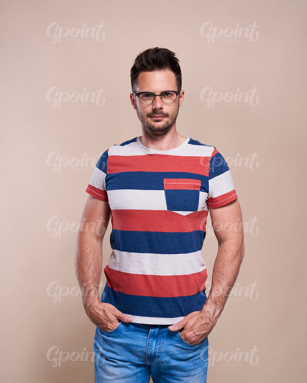 Portrait of handsome man in glasses in studio shot