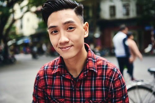 Portrait of young Vietnamese man in the city