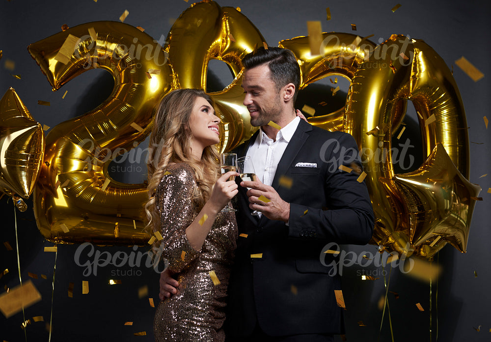 Loving couple making a toast to New Year