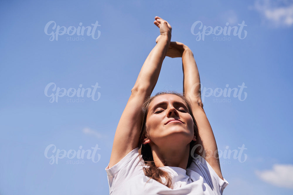 Close up of woman stretching on fresh air