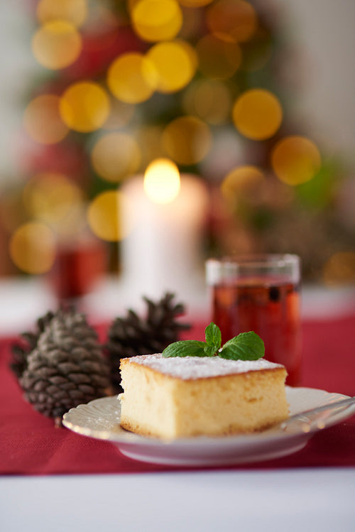 Cheesecake and Christmas tree in the background