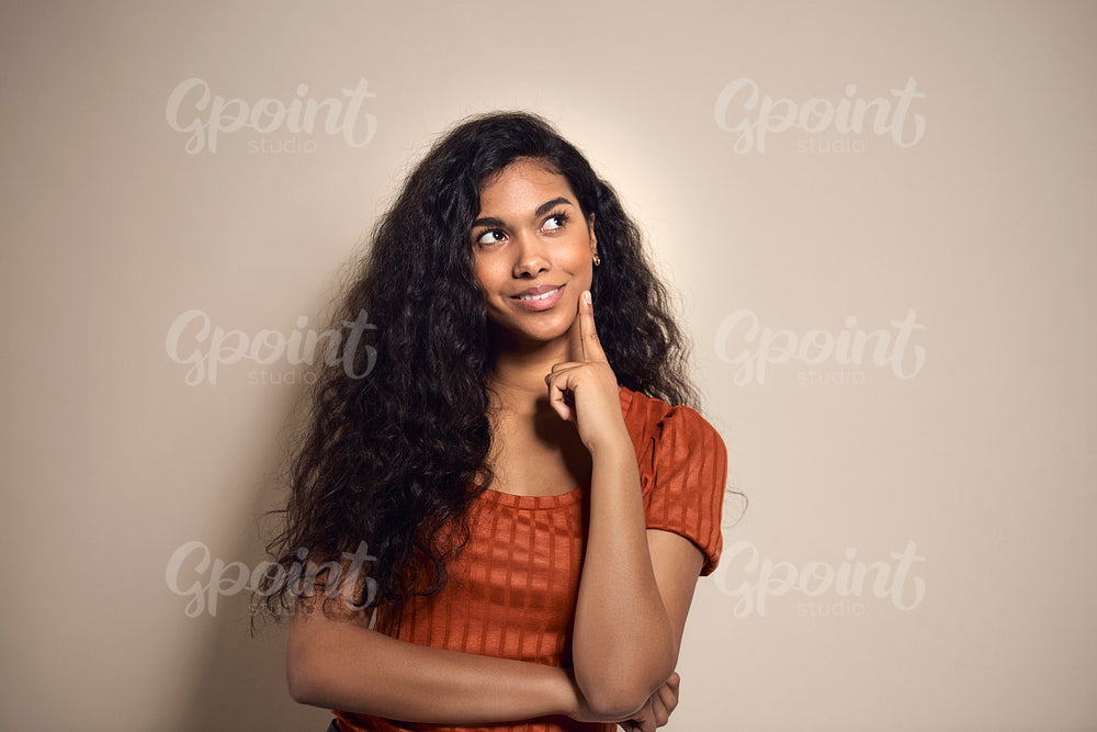 Mixed race woman thinking about something