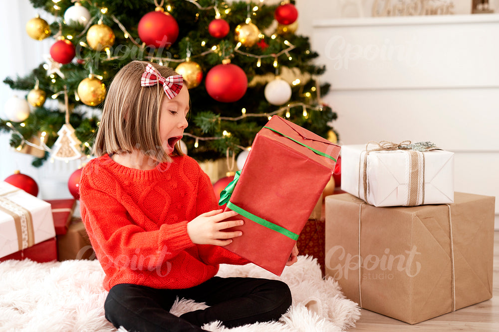 Excited girl with Christmas gift