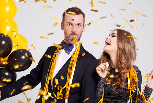 Couple with horn blower partying