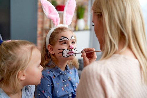 Close up of face painting for little Easter bunny at home