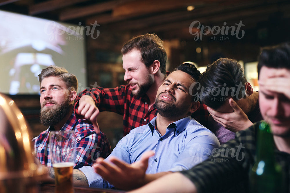 Scene of annoyed fans in the pub