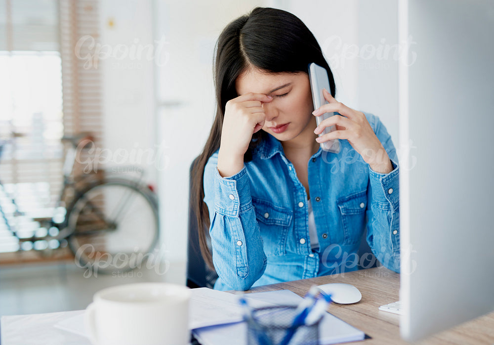 Woman having hard day in the office