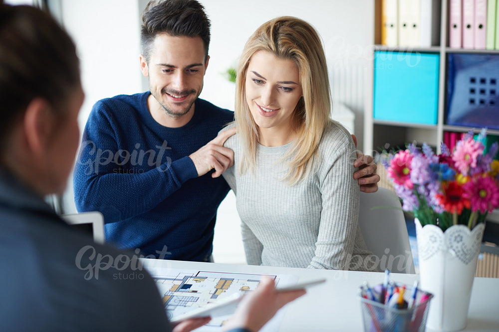Young couple reading important paperwork
