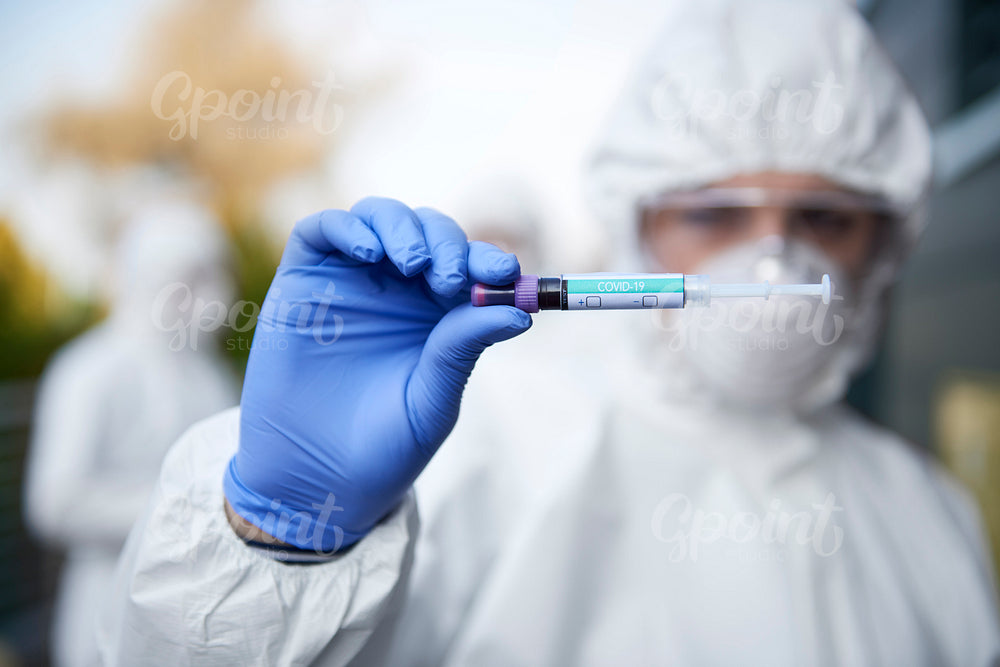 Technician holding a coronavirus test