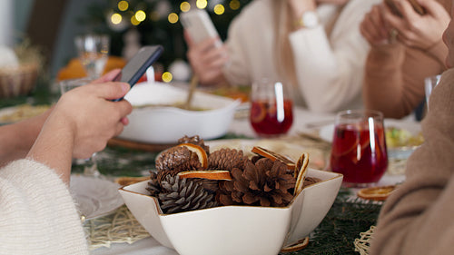 Family spending Christmas Eve with mobile phones