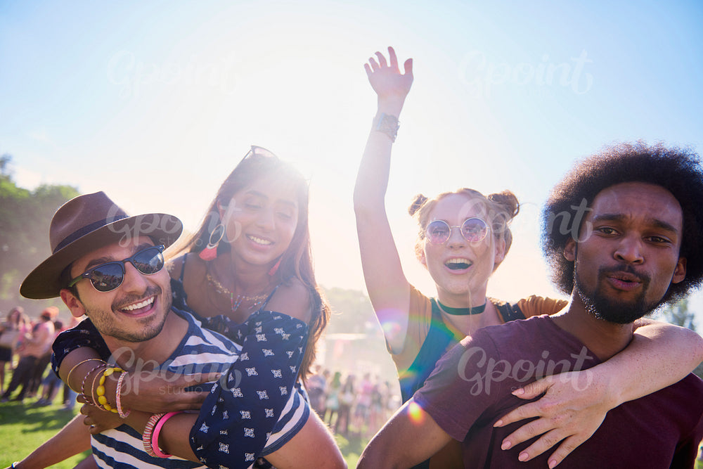 Two playful couples having great fun at music festival