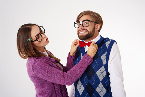 Geek woman adjusting bow tie
