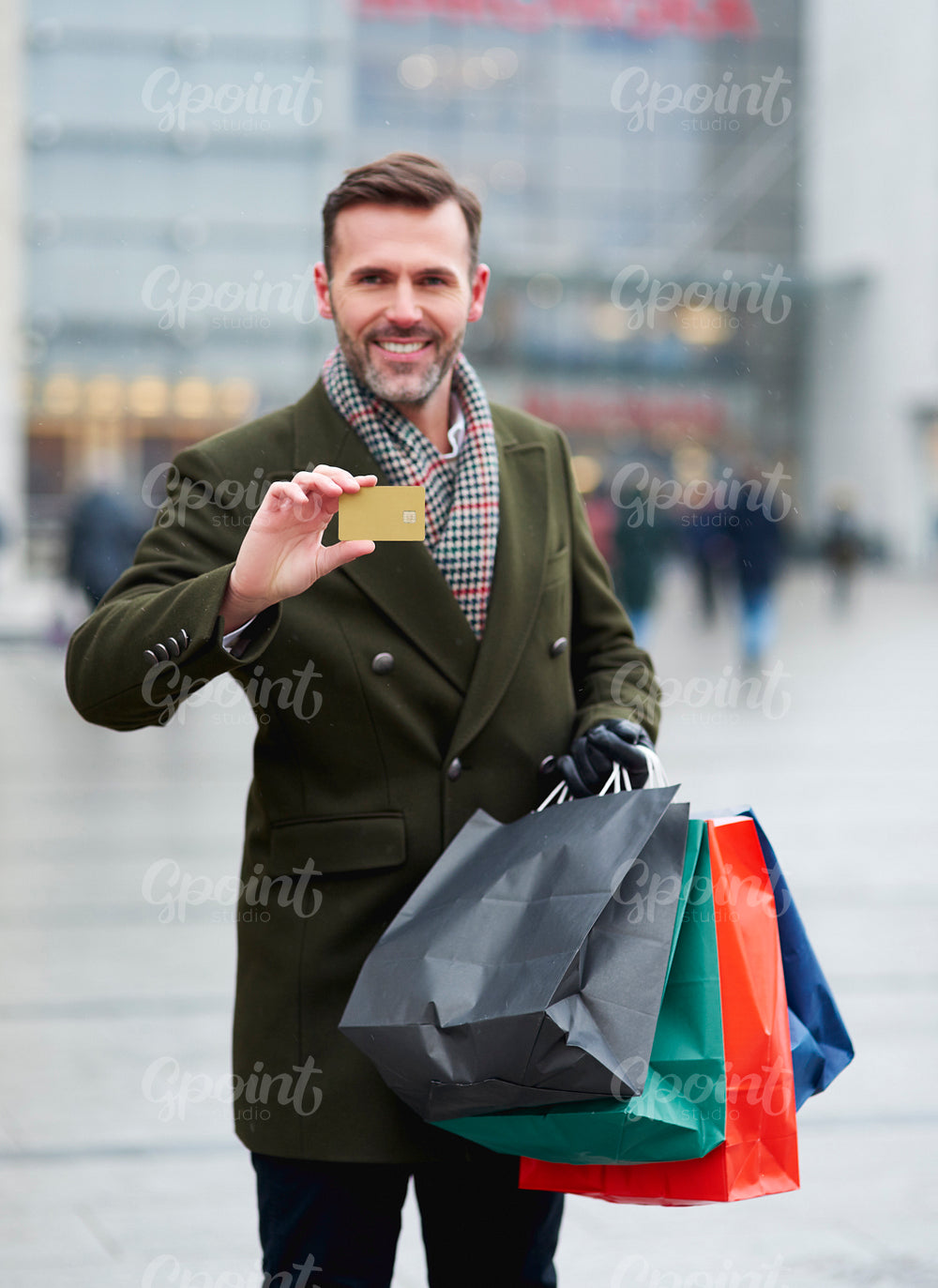 Man paying by credit card for Christmas shopping