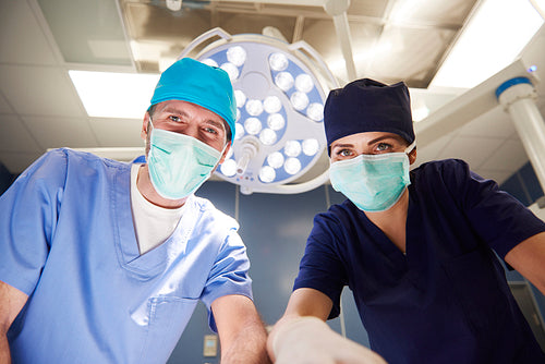 Portrait of two surgeons over the operating table