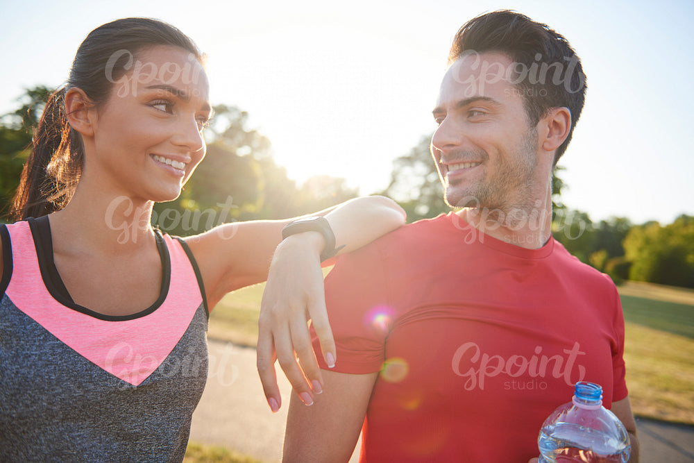 Young couple talking after workout on the fresh air