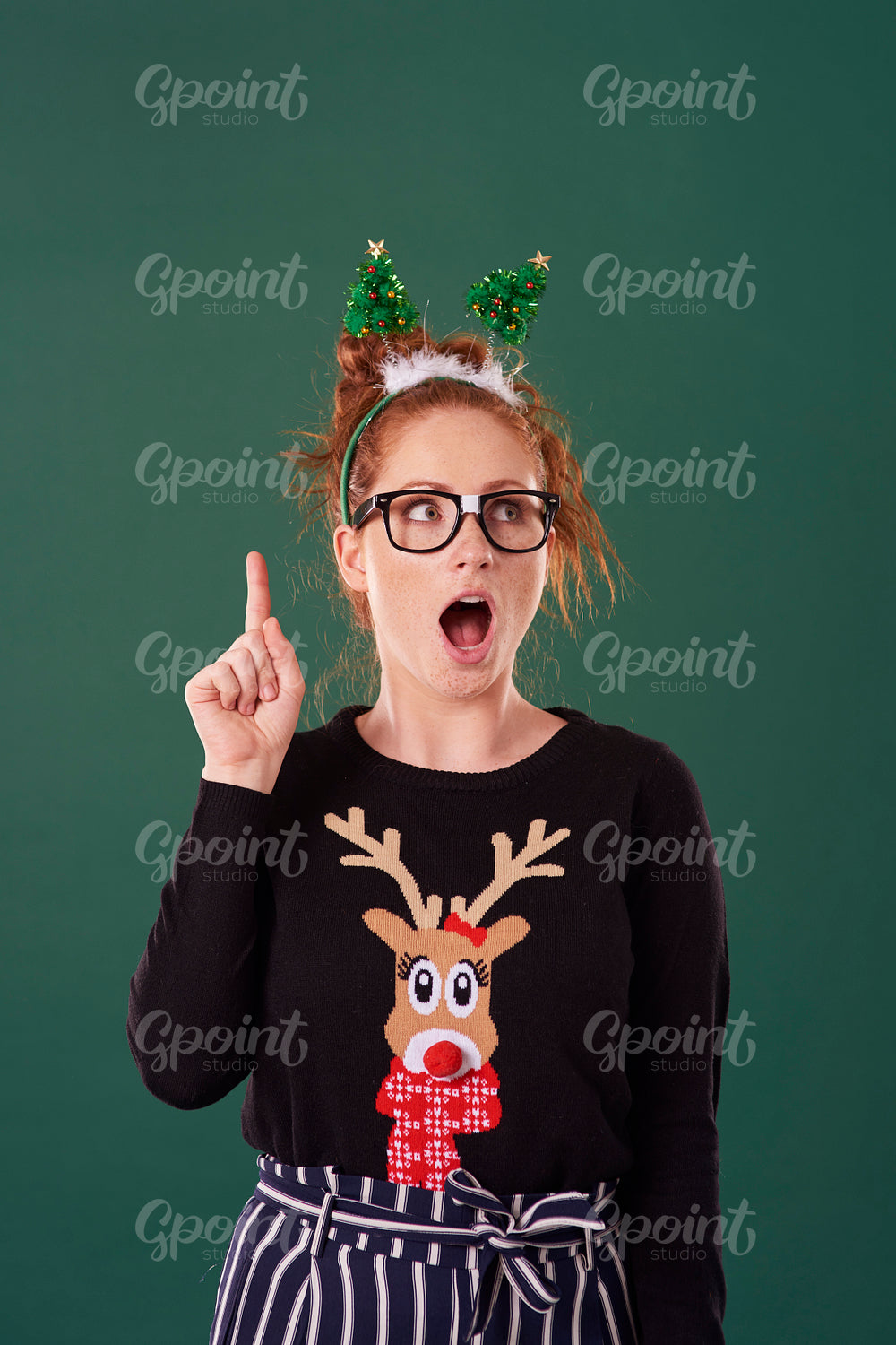 Screaming woman pointing at copy space