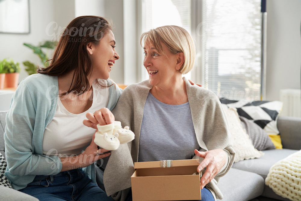Cheerful woman informs mom that she will become a grandmother