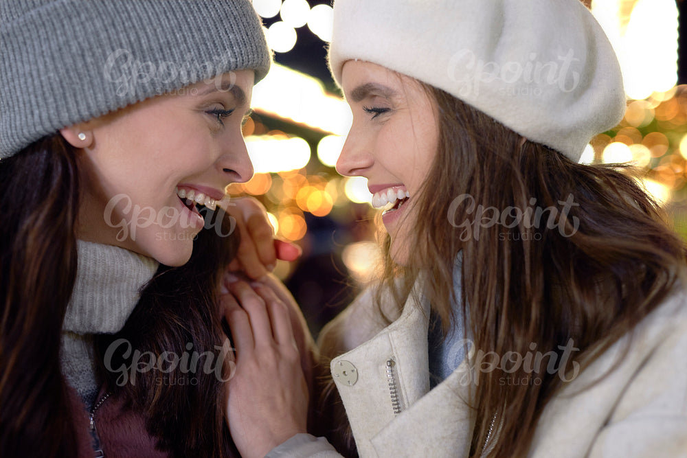 Close up of two friends on Christmas market