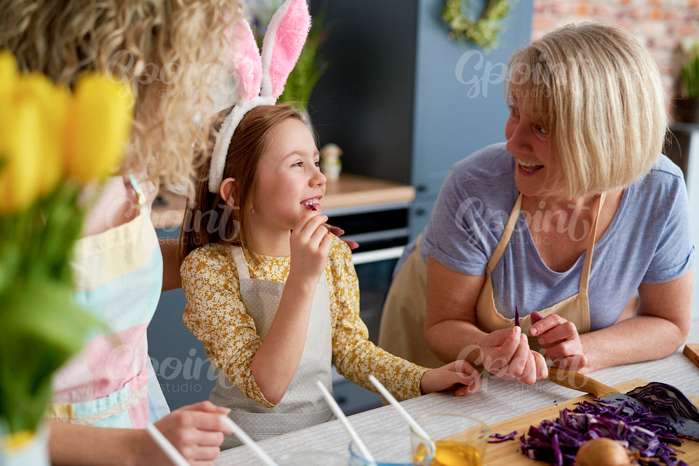 Little girl with her mother and grandmother during Easter