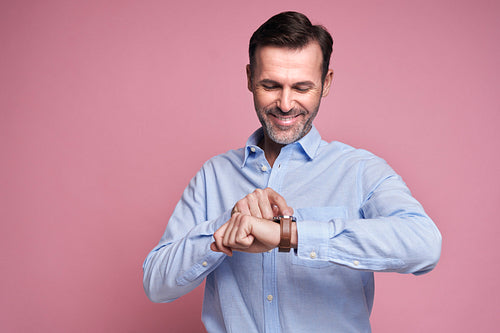 Happy man showing for smart watch