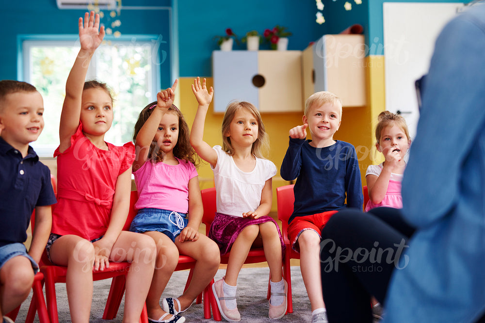 Group of preschool children answering a question