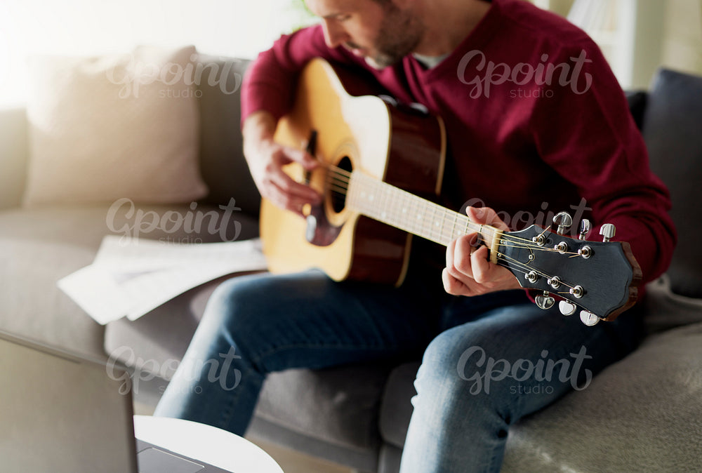 Man having first lesson with acoustic guitar
