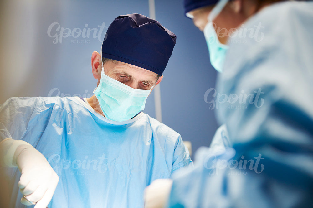 Senior surgeon during very important operation