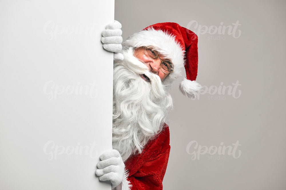 Caucasian Santa Claus with white blackboard 