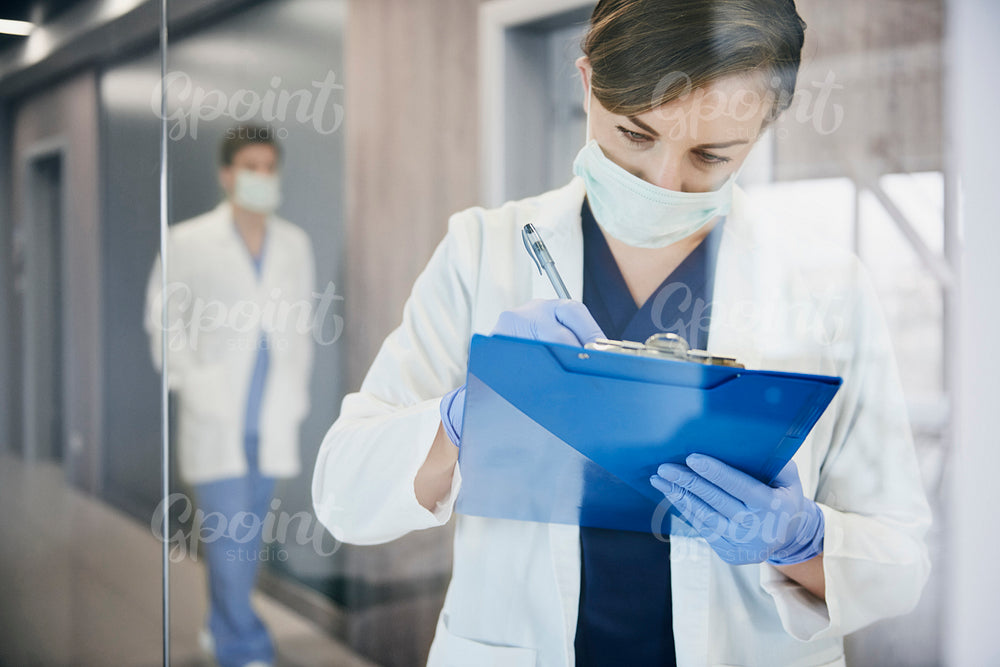 Busy doctor during a medical exam