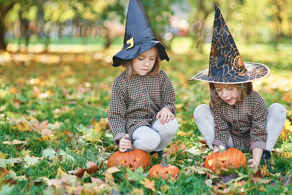 Twins in witch costume during Halloween time