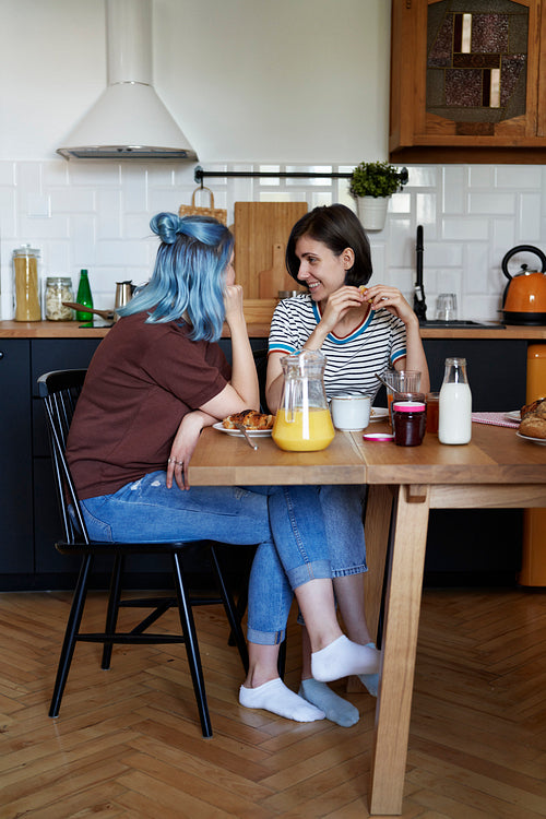 Two woman eating breakfast together