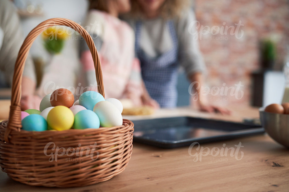 Close up of wicker basket full of Easter eggs