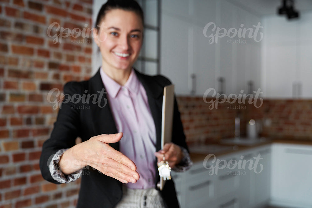 Real estate agent reaches out for a handshake