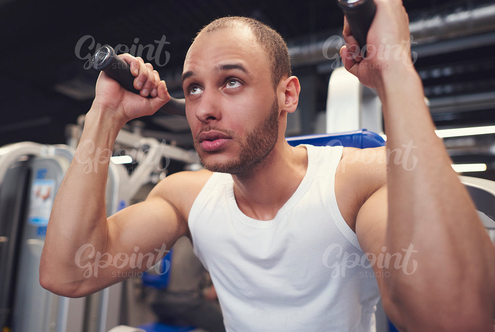 Man doing training with exercise machine