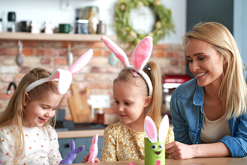 Happy mom with daughters during Easter time