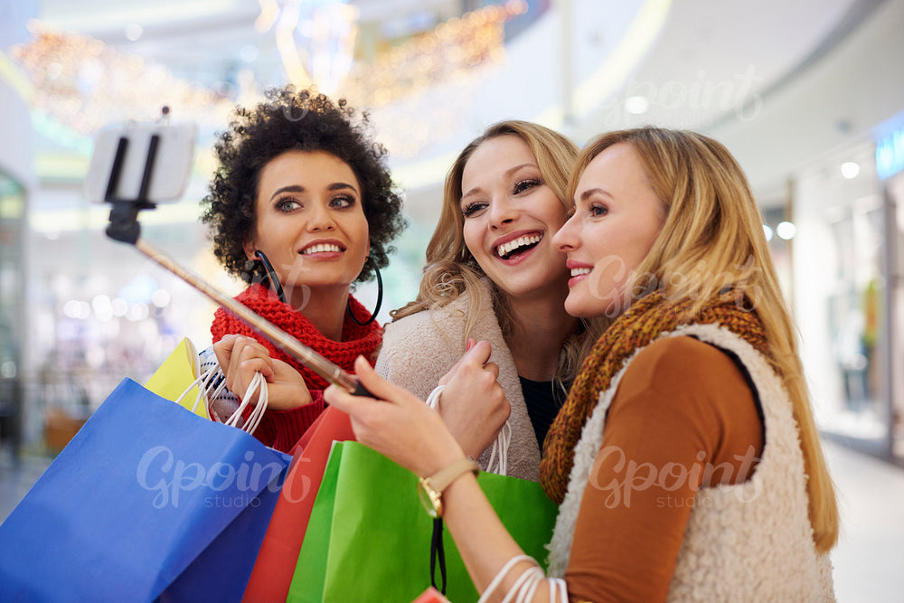 Women taking selfie in the shopping mall
