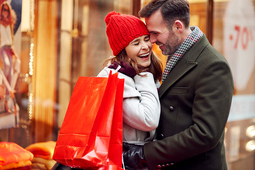 Romantic moment of couple during Christmas shopping