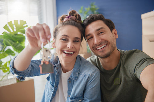 Young couple holding a bunch of home keys