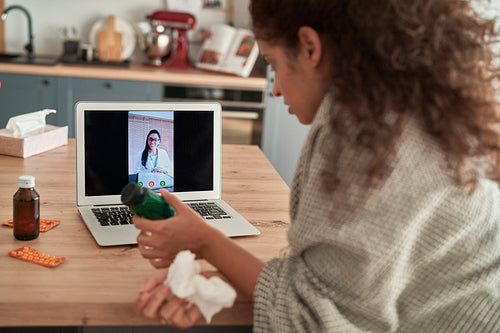 Sick woman during telemedicine at home