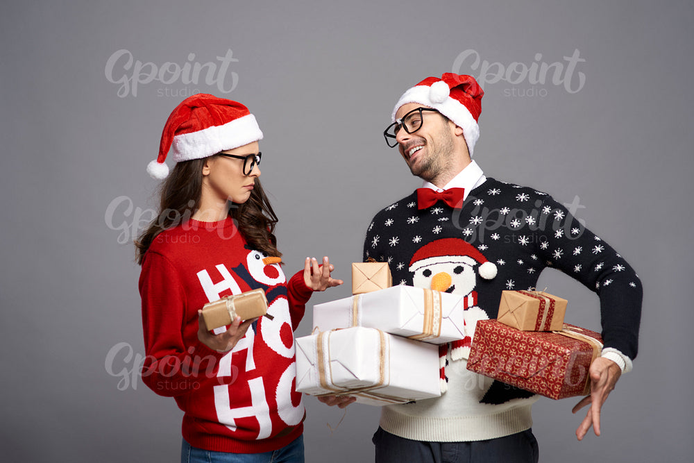 Nerd couple exchanging Christmas presents