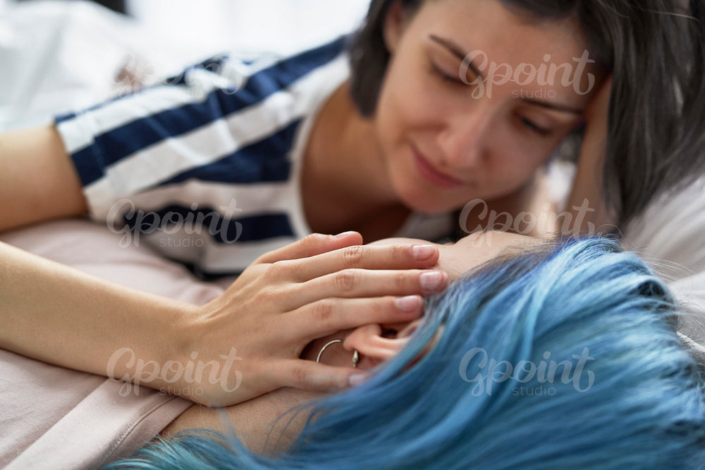Close up of lesbian couple stroking the cheek