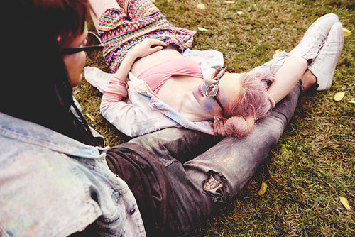 Couple relaxing on the grass before the concert