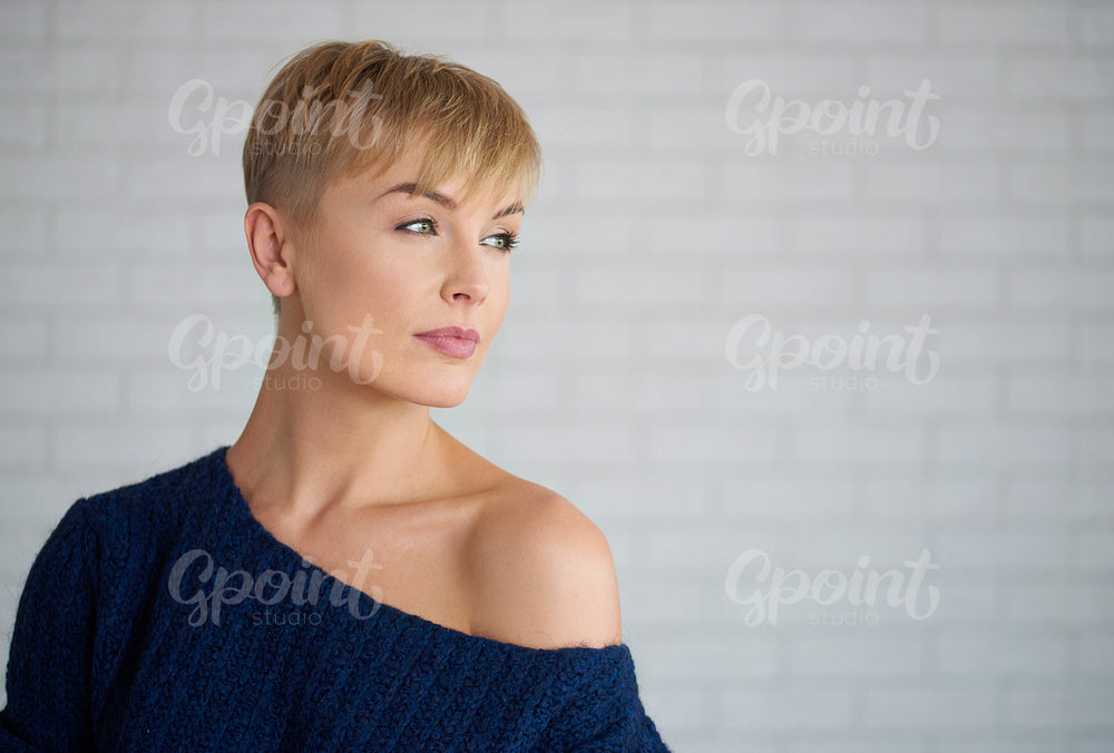 Beautiful, mature woman looking at copy space