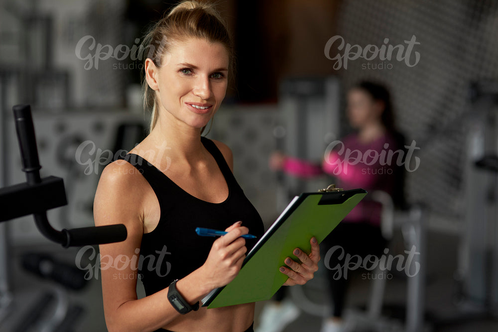 Portrait of female fitness instructor at the gym