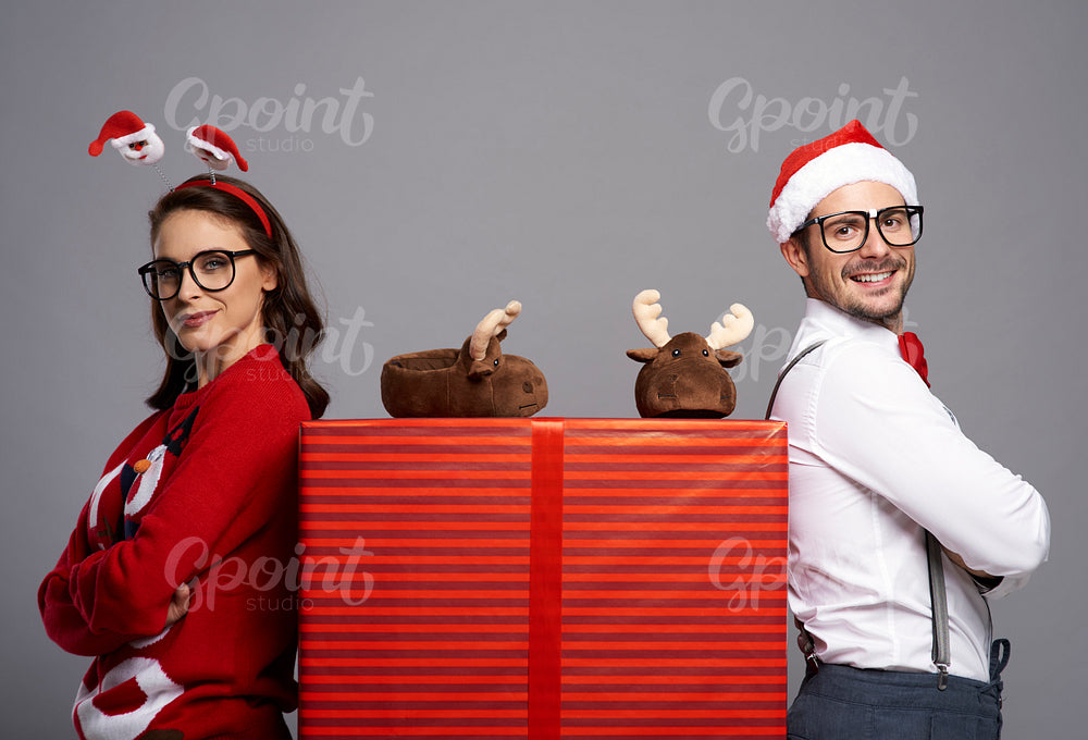 Portrait of happy couple with big Christmas gift