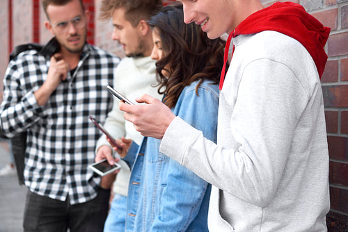 Group of young people using smart phone