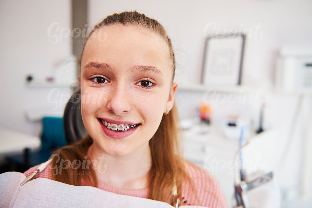 Portrait of smiling teenage girl with braces