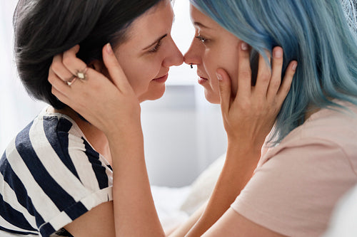Side view of lesbian couple looking deep in the eyes