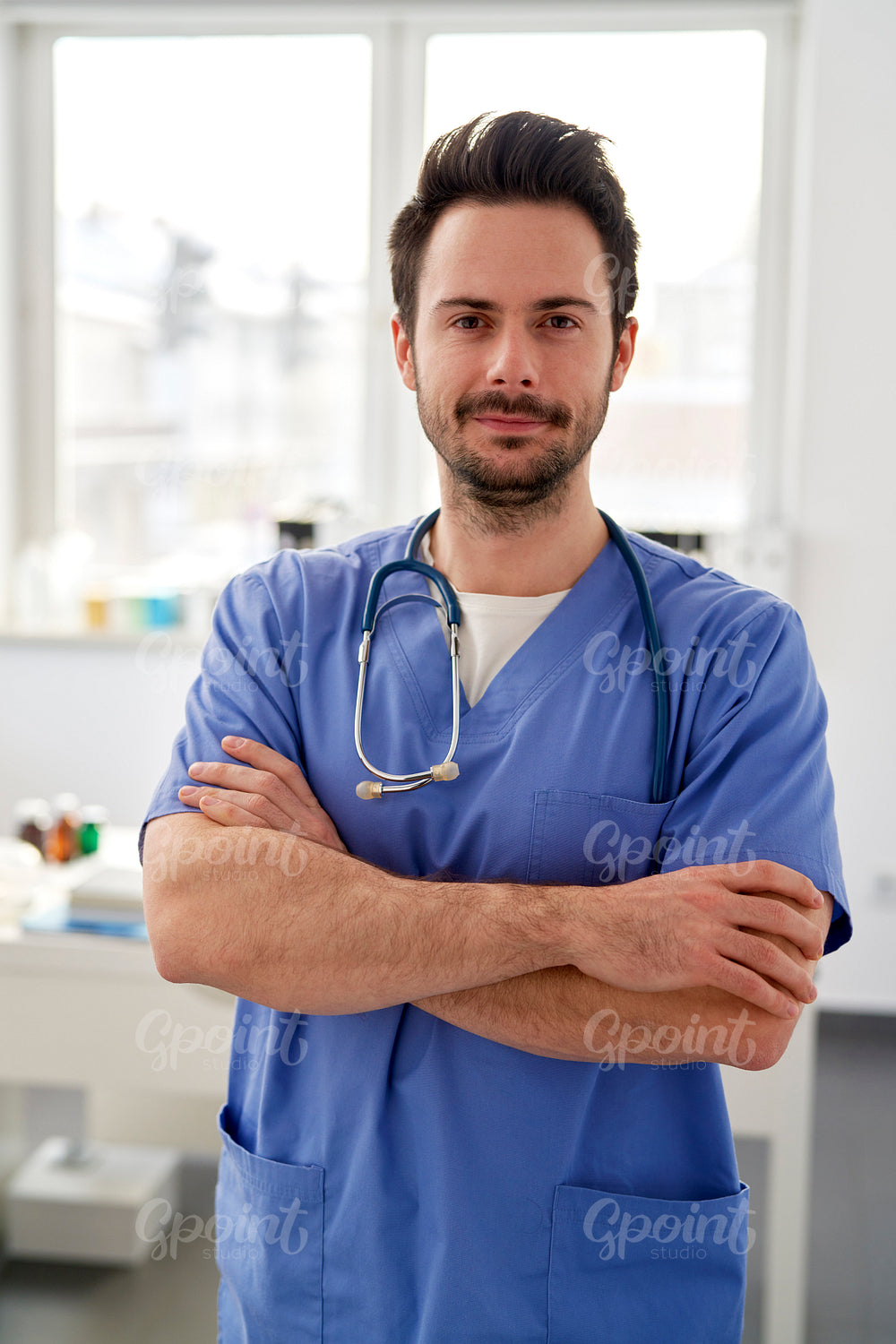 Portrait of young smiling doctor in the doctor's office
