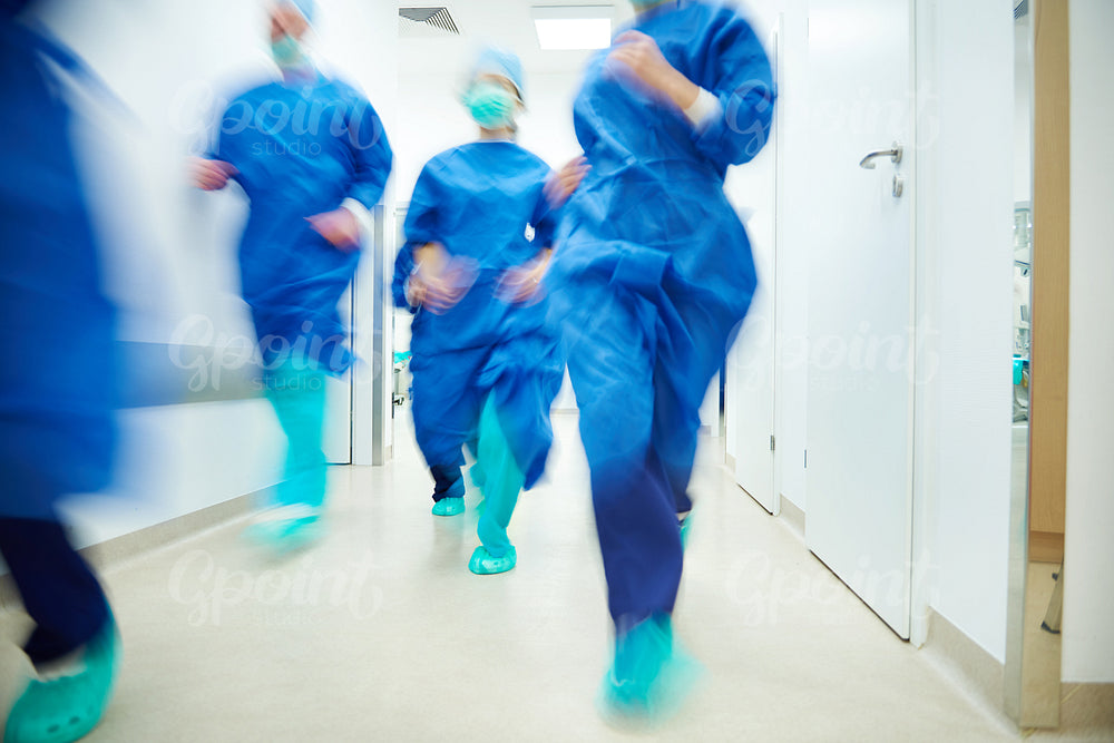 Running doctors going to help a patient